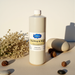 Bottle of Nail Prep and Wipe 32oz by Gelousy surrounded by natural decorative elements in soft lighting